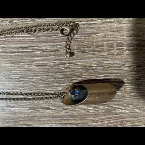 Metallic brass necklace with Chrystal or stone in center